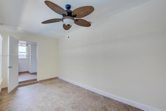 unfurnished room with ceiling fan