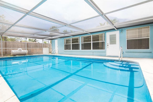 view of pool with a lanai