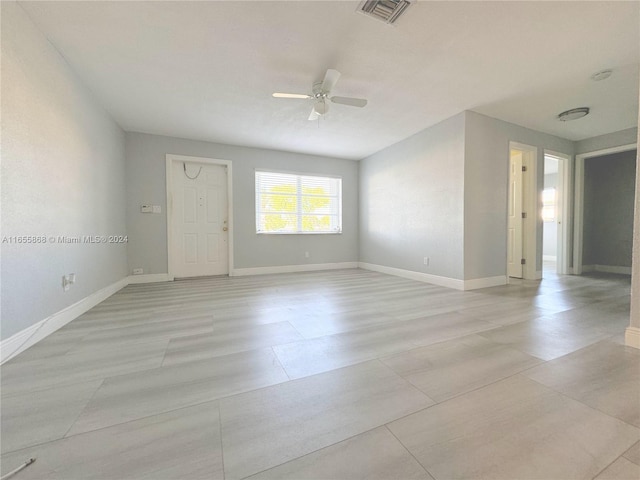 unfurnished room with ceiling fan