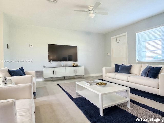 living room with light colored carpet and ceiling fan