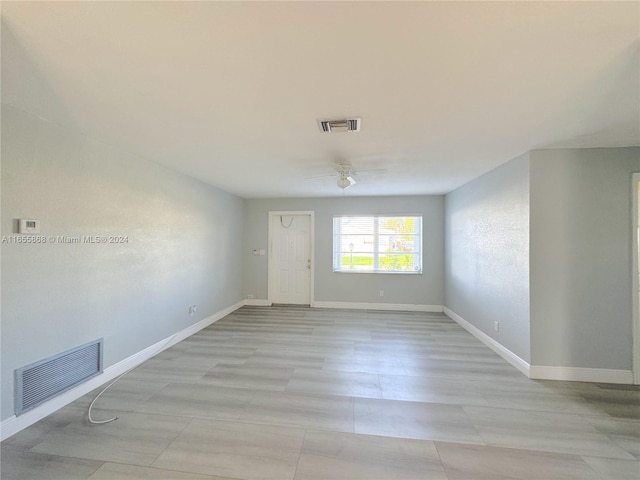 unfurnished room featuring ceiling fan