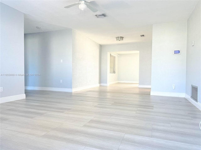 spare room with ceiling fan