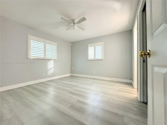 unfurnished room featuring ceiling fan