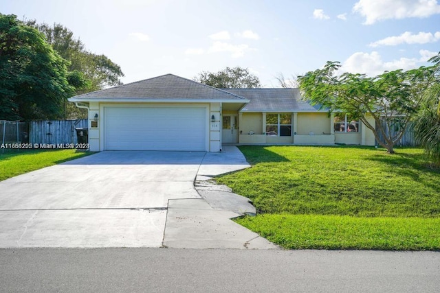 ranch-style house with a garage and a front yard