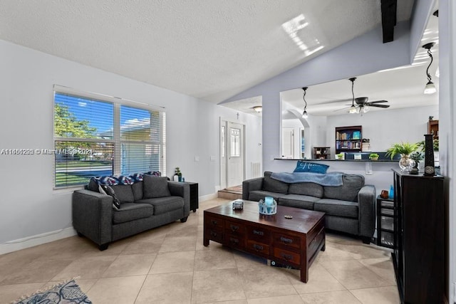 tiled living room with a textured ceiling, vaulted ceiling, and ceiling fan