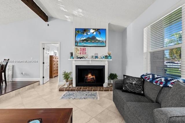 tiled living room featuring a textured ceiling and vaulted ceiling with beams