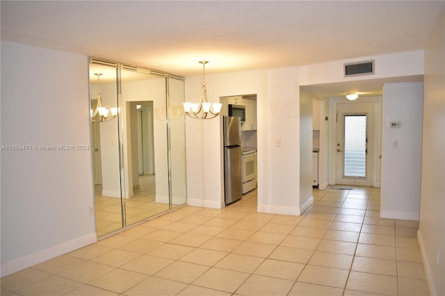 interior space featuring a chandelier and light tile patterned floors