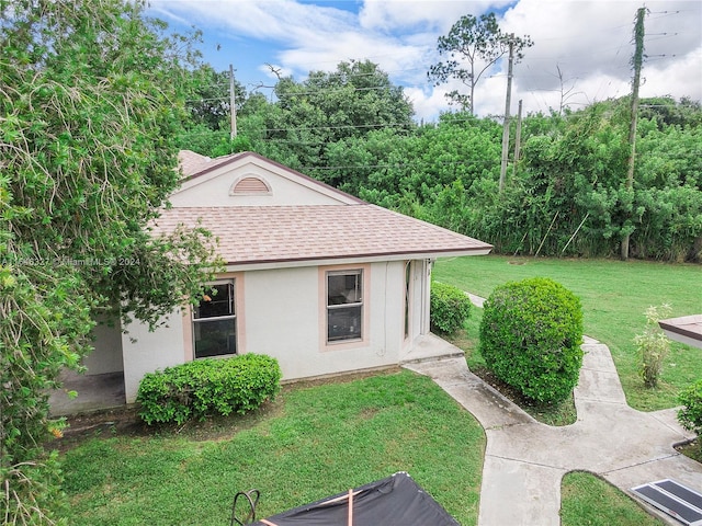 exterior space with a front lawn