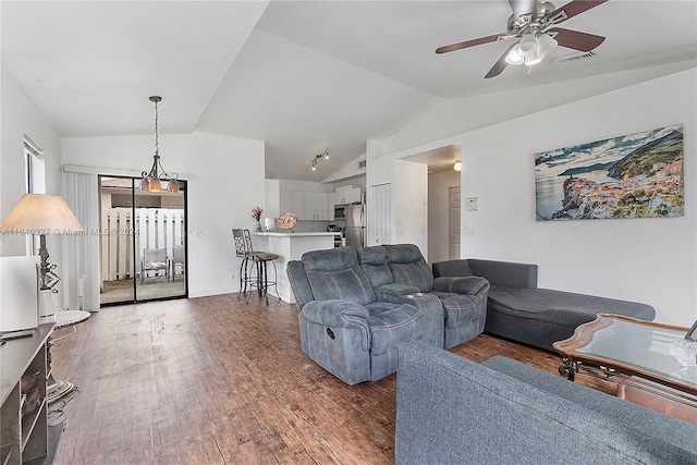 living room featuring vaulted ceiling, ceiling fan, and dark hardwood / wood-style floors