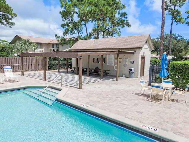 view of swimming pool with a patio