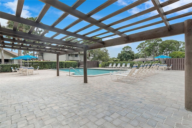 view of pool featuring a pergola and a patio area