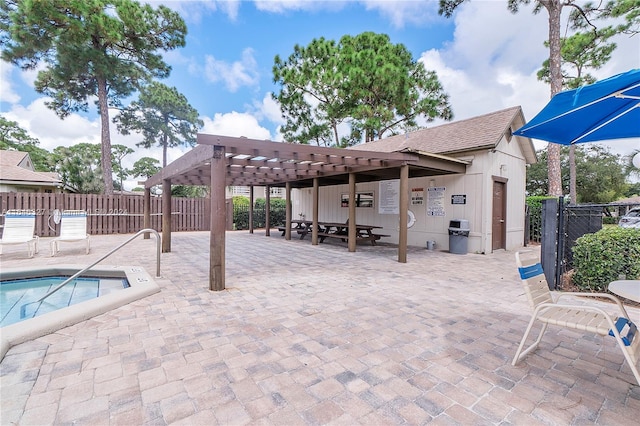 view of patio / terrace with a pergola and a swimming pool