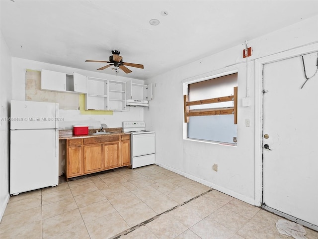 kitchen featuring white appliances, light tile patterned floors, sink, and ceiling fan