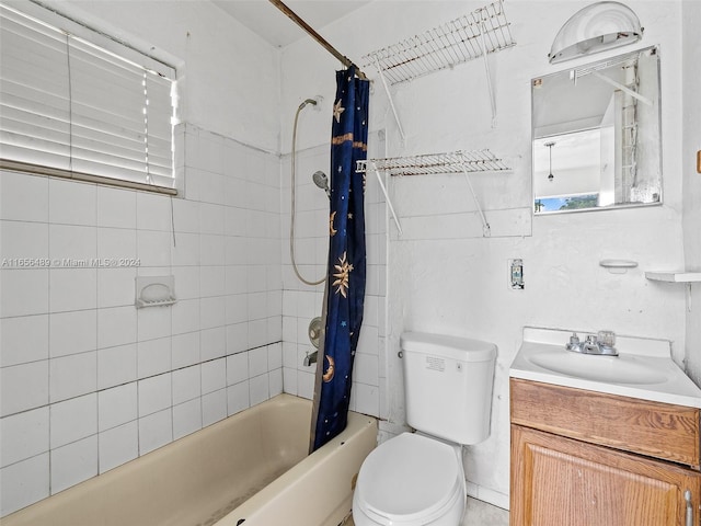 full bathroom featuring vanity, toilet, and shower / tub combo