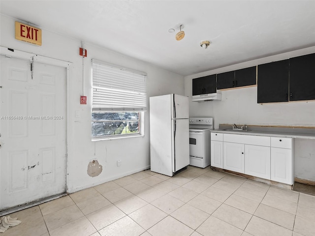 kitchen featuring white appliances, light tile patterned floors, white cabinetry, and sink