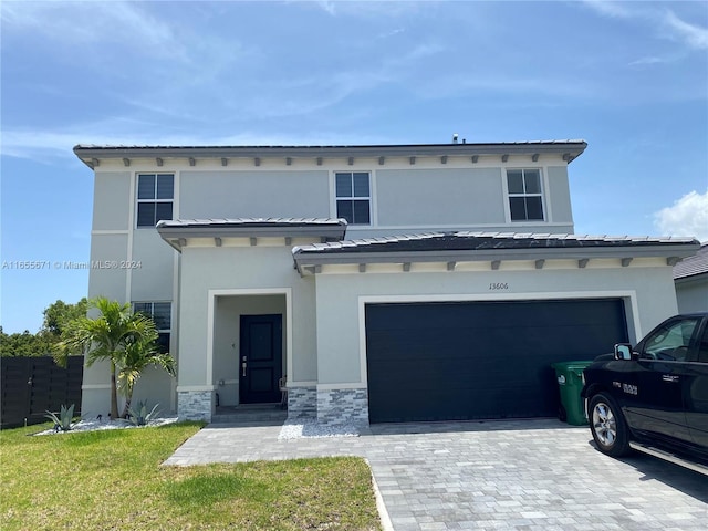 view of front of property featuring a garage