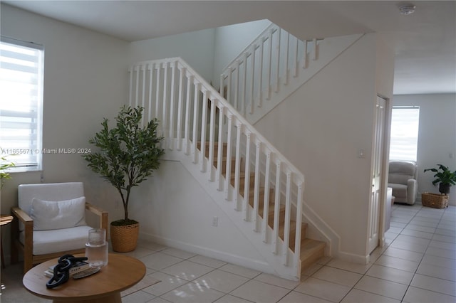 stairs featuring tile patterned floors