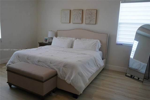 bedroom with light hardwood / wood-style floors