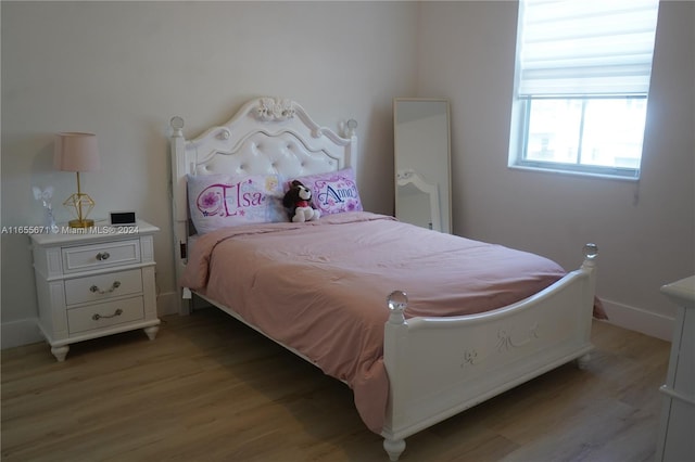 bedroom with light wood-type flooring