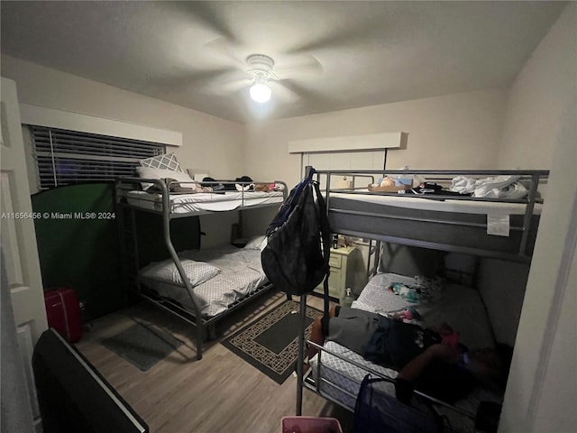 bedroom with hardwood / wood-style floors and ceiling fan