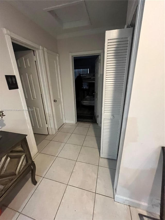 hallway featuring light tile patterned floors