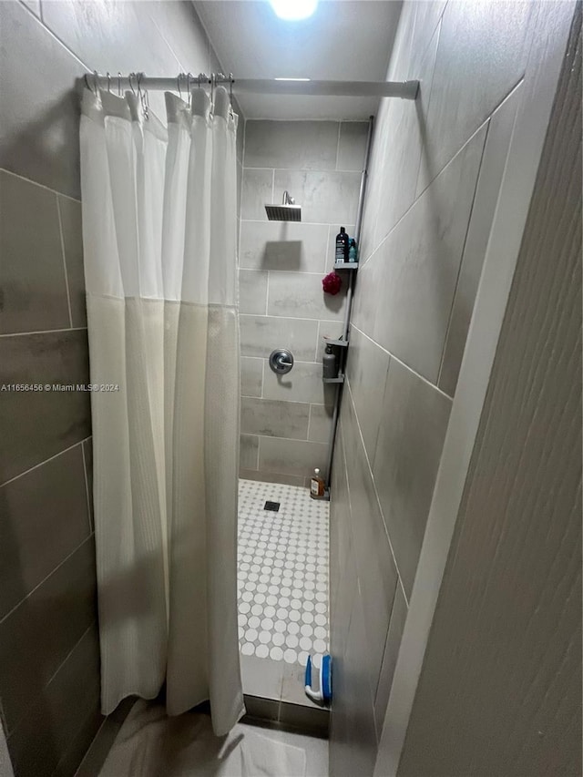 bathroom with a shower with curtain