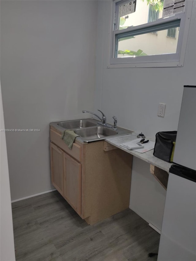 bathroom with sink and hardwood / wood-style floors