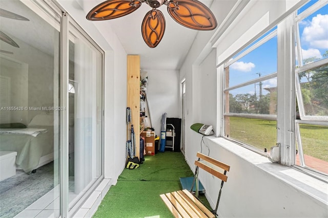 sunroom featuring plenty of natural light and ceiling fan