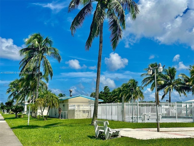 view of property's community with a lawn