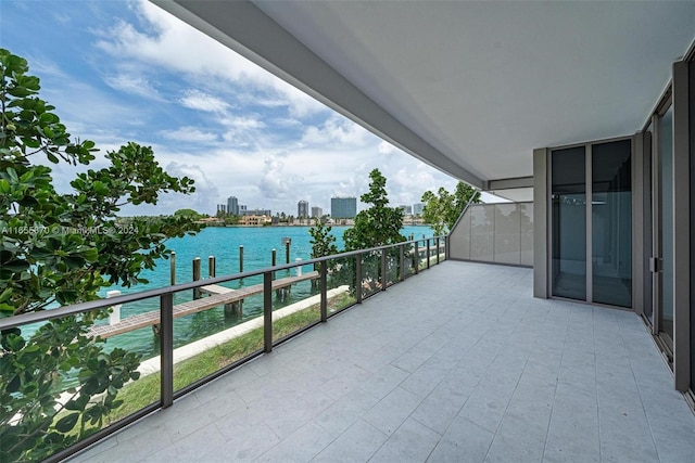 balcony featuring a water view