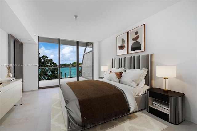 bedroom with a water view, a wall of windows, and access to exterior