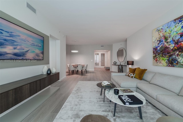 living room with light hardwood / wood-style flooring