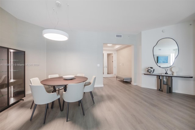 dining space featuring light hardwood / wood-style floors