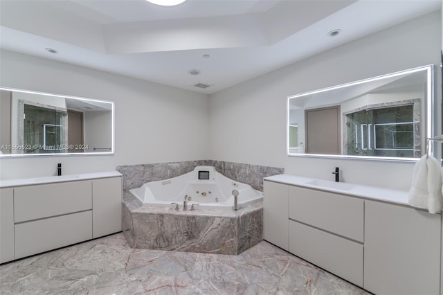 bathroom featuring vanity and shower with separate bathtub