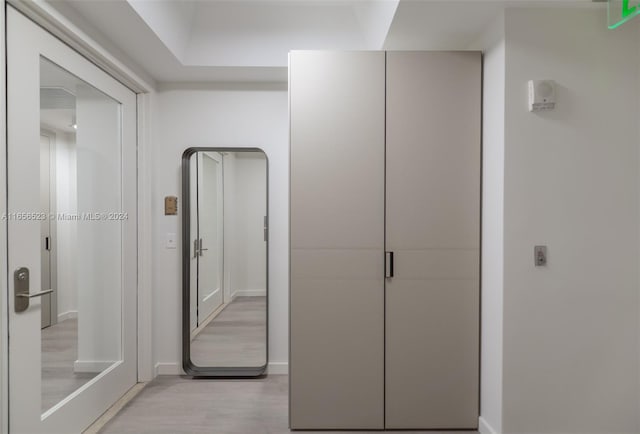 corridor with light wood-type flooring