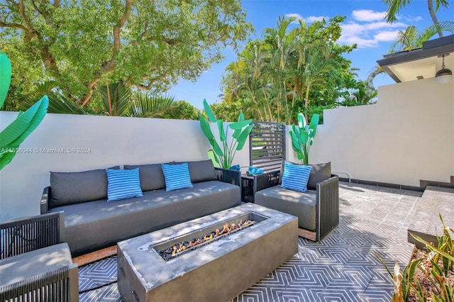 view of patio / terrace with an outdoor fire pit