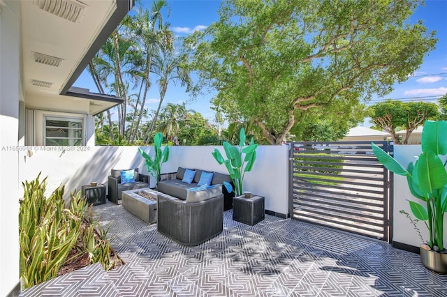 view of patio / terrace with an outdoor fire pit