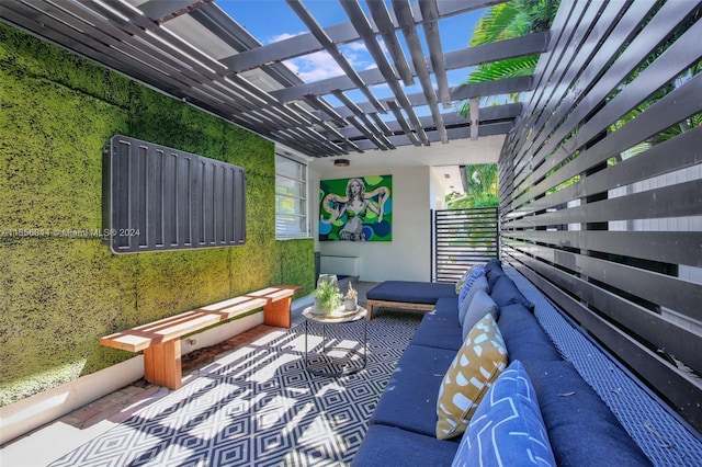 view of patio with an outdoor hangout area and a pergola