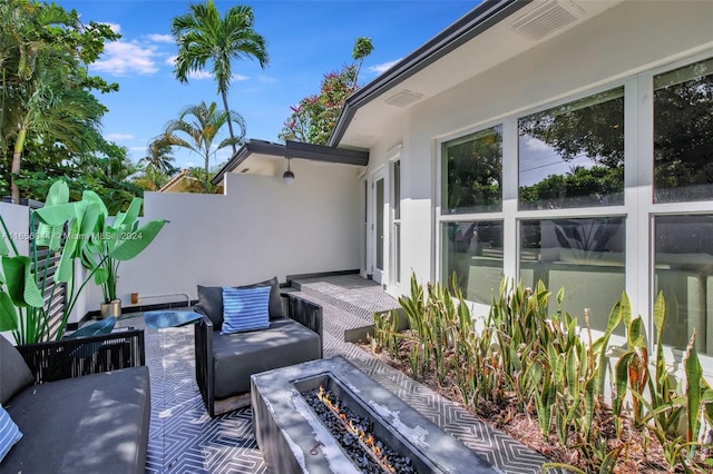 view of patio with an outdoor fire pit