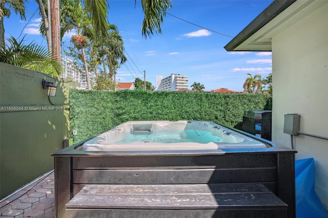 view of patio featuring an outdoor hot tub