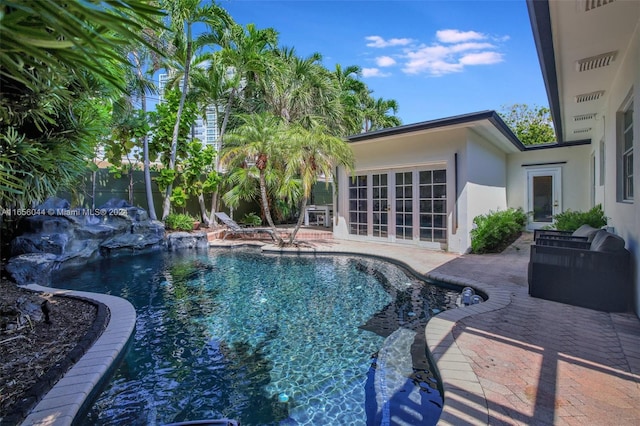 view of swimming pool featuring a patio area