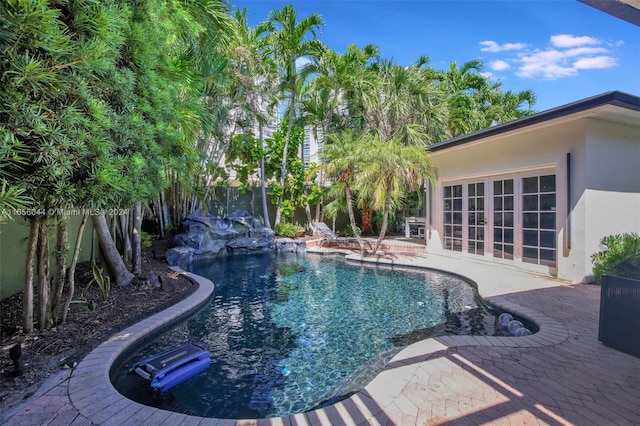 view of swimming pool featuring a patio