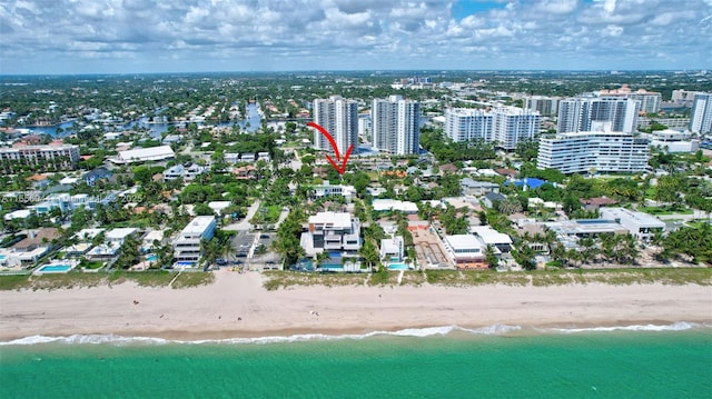 aerial view featuring a water view and a beach view