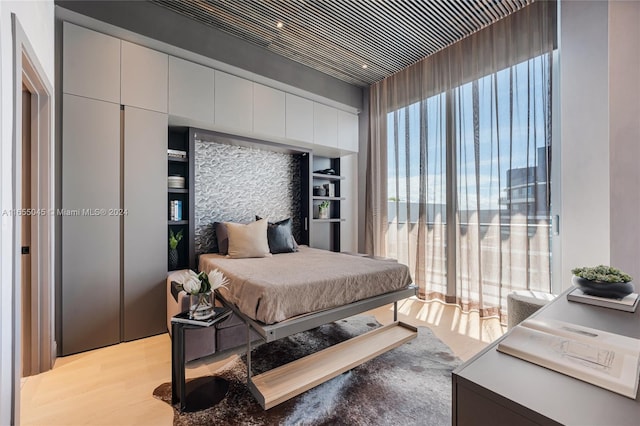 bedroom featuring light hardwood / wood-style floors and a closet