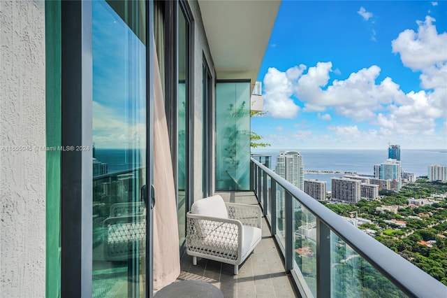 balcony featuring a water view