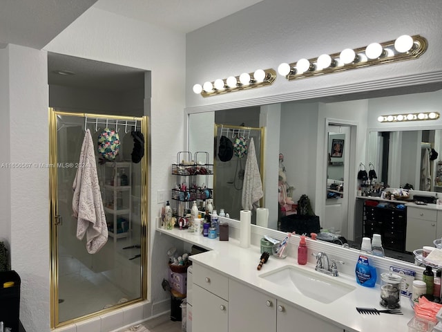 bathroom with vanity and an enclosed shower