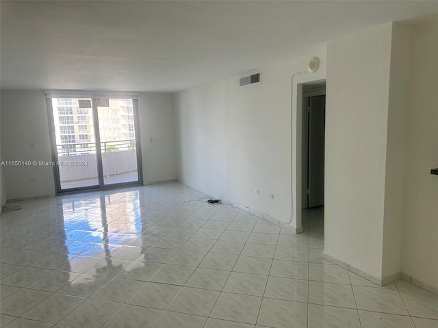 empty room featuring light tile patterned floors