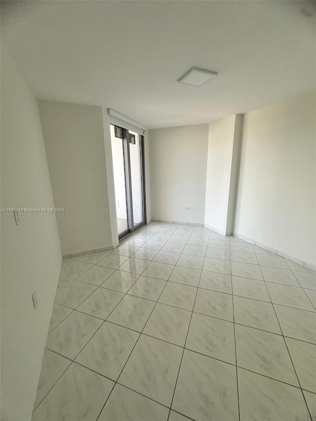 empty room featuring light tile patterned floors