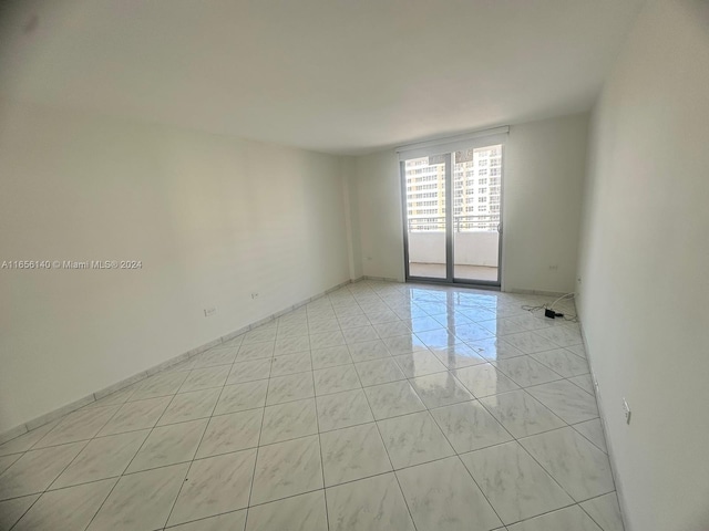 empty room featuring light tile patterned flooring