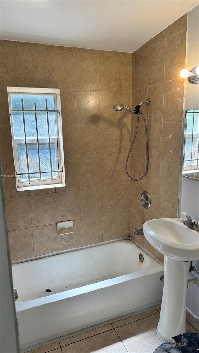 bathroom with tiled shower / bath combo and tile patterned floors